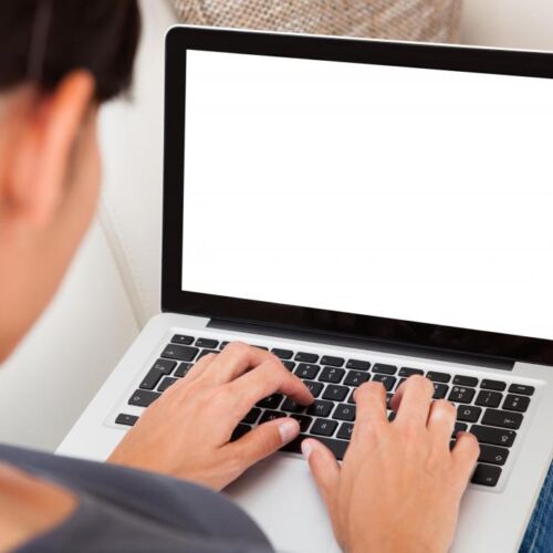 woman-sitting-down-typing-on-computer